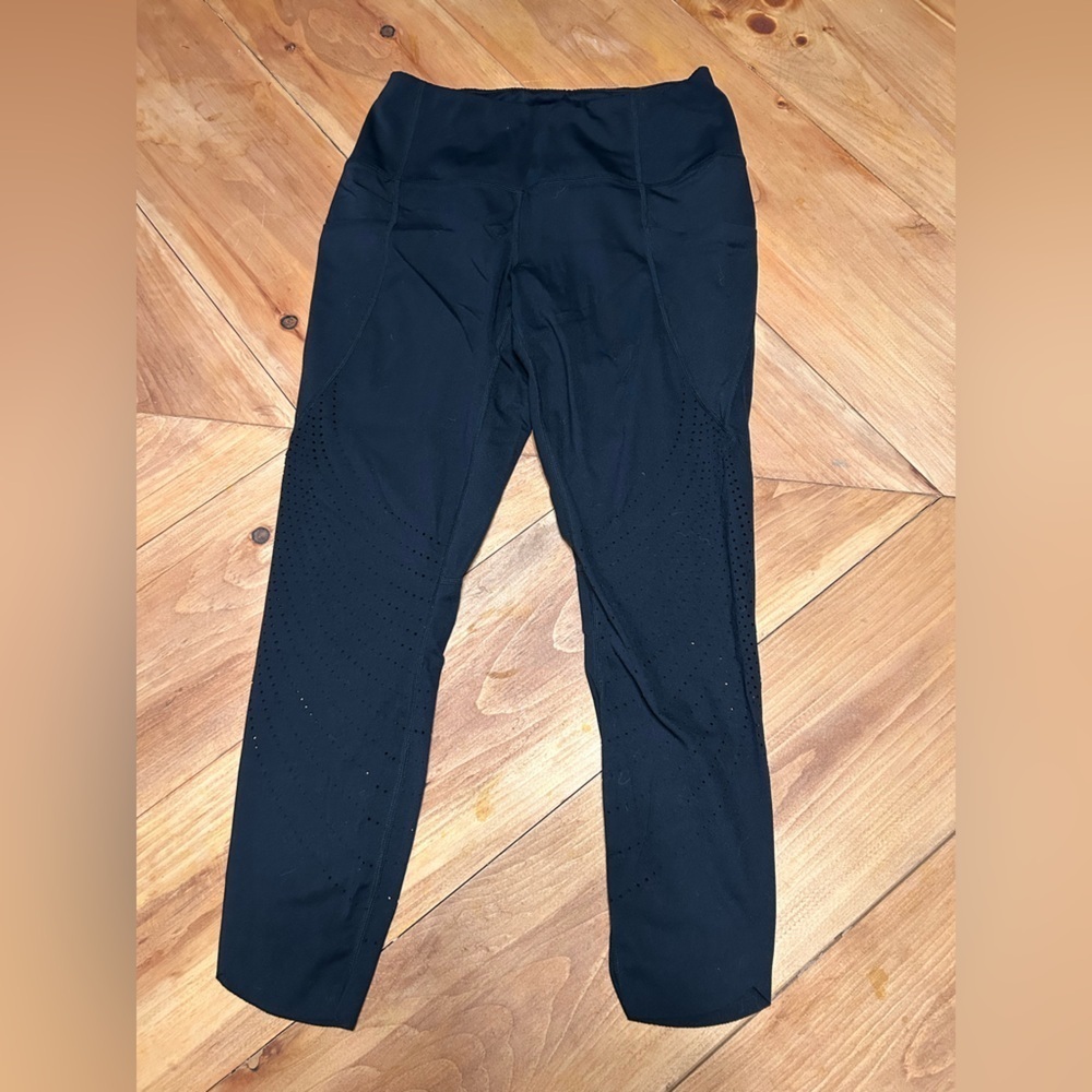 Women's Black Leggings size Medium with pockets and cut out design
